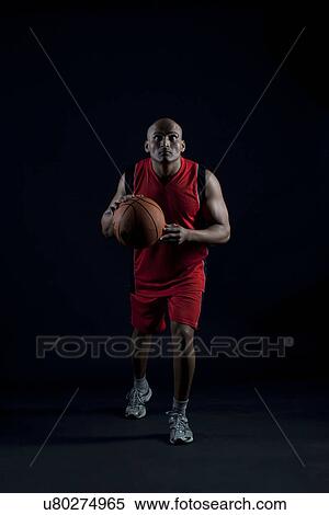 Man playing basketball View Large Photo Image Stock Photography - Man playing basketball . Fotosearch