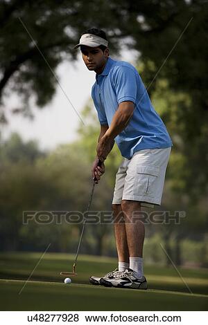 Stock Photo - Man playing golf . Fotosearch