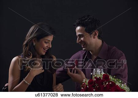 Man proposing to woman View Large Photo Image Stock Photo - Man proposing to woman. Fotosearch