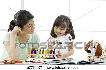 Picture - Mother and daughter with an abacus . Fotosearch