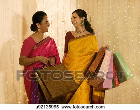Mother and daughter with shopping bags View Large Photo Image Stock Photography - Mother and daughter with shopping bags . Fotosearch