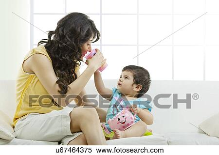 Mother playing with her child View Large Photo Image Stock Photography - Mother playing with her child . Fotosearch