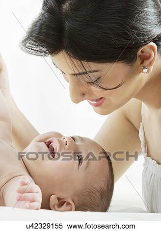 Mother with her baby View Large Photo Image Stock Photography - Mother with her baby . Fotosearch