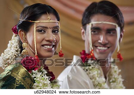 Picture - Newlywed Maharashtrian couple smiling together . Fotosearch