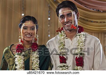 Stock Image - Newlywed Maharashtrian couple smiling together . Fotosearch