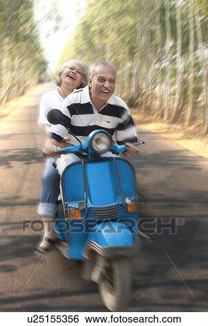 Old couple on a scooter View Large Photo Image Stock Photograph - Old couple on a scooter . Fotosearch