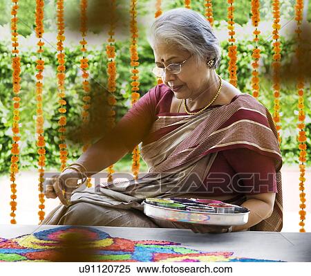 Old woman making a rangoli  View Large Photo Image Stock Photography - Old woman making a rangoli . Fotosearch