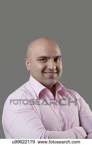 Stock Photo - Portrait of a bald man . Fotosearch