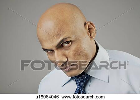 Stock Photograph - Portrait of a bald man . Fotosearch