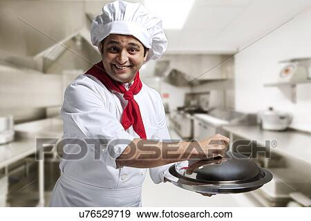 Portrait of a chef with a tray View Large Photo Image Stock Photo - Portrait of a chef with a tray . Fotosearch