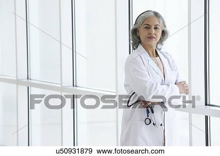 Portrait of a female doctor View Large Photo Image Stock Photo - Portrait of a female doctor. Fotosearch