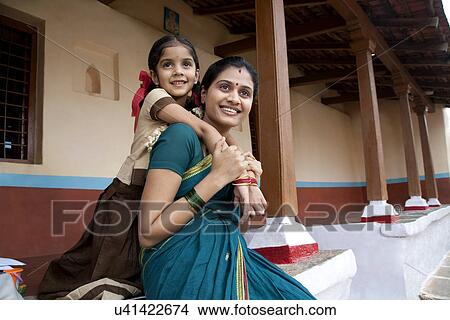 Portrait of a girl and her mother View Large Photo Image Picture - Portrait of a girl and her mother . Fotosearch