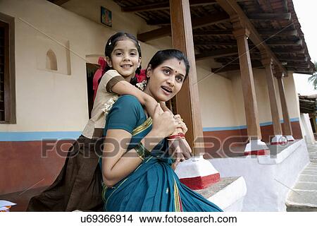 Picture - Portrait of a girl and her mother . Fotosearch
