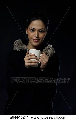 Portrait of a girl with a mug of tea View Large Photo Image Stock Image - Portrait of a girl with a mug of tea . Fotosearch
