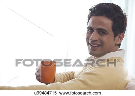 Portrait of a man with a mug of tea View Large Photo Image Stock Photography - Portrait of a man with a mug of tea. Fotosearch