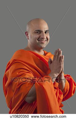 Stock Image - Portrait of a monk praying . Fotosearch