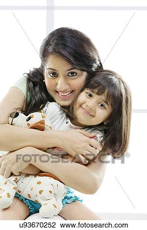 Portrait of a mother and daughter View Large Photo Image Stock Image - Portrait of a mother and daughter . Fotosearch