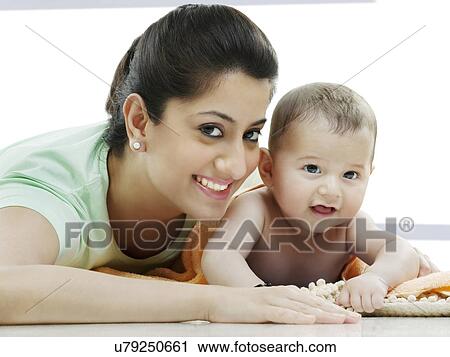 Portrait of a mother with her baby View Large Photo Image Stock Image - Portrait of a mother with her baby . Fotosearch