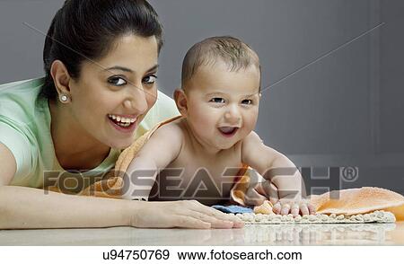 Stock Photo - Portrait of a mother with her baby . Fotosearch