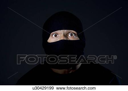 Portrait of a robber View Large Photo Image Stock Photo - Portrait of a robber . Fotosearch