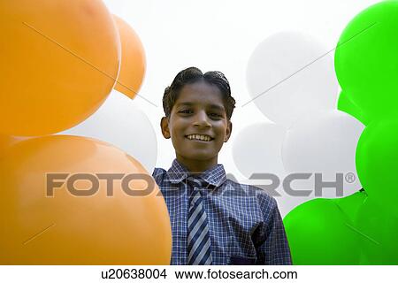 Picture - Portrait of a school boy with balloons . Fotosearch