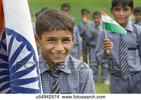 Portrait of a school boy with the Indian flag View Large Photo Image Picture - Portrait of a school boy with the Indian flag . Fotosearch