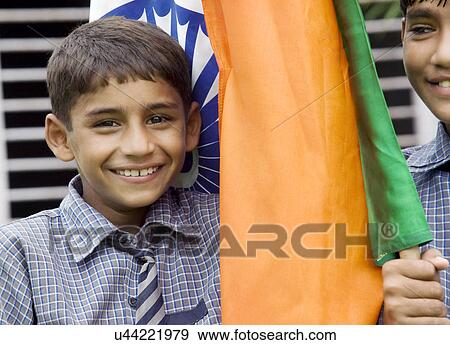 Portrait of a school boy with the Indian flag View Large Photo Image Stock Photo - Portrait of a school boy with the Indian flag . Fotosearch