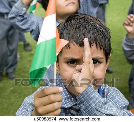 Portrait of a school girl holding the Indian flag View Large Photo Image Picture - Portrait of a school girl holding the Indian flag . Fotosearch