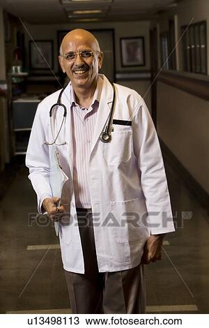Stock Image - Portrait of a senior doctor . Fotosearch
