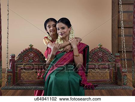 Stock Image - Portrait of a South Indian woman with her daughter . Fotosearch