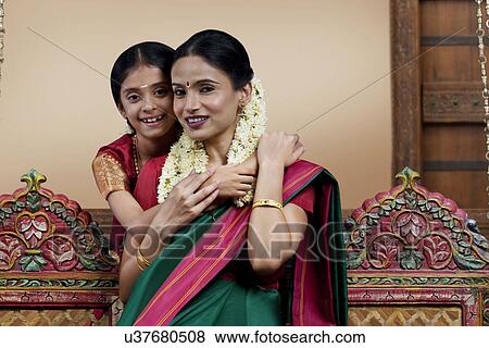 Stock Photo - Portrait of a South Indian woman with her daughter . Fotosearch