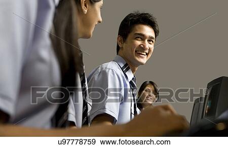 Portrait of a student in a computer lab View Large Photo Image Stock Photo - Portrait of a student in a computer lab . Fotosearch