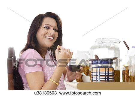Portrait of a woman eating pickle View Large Photo Image Stock Image - Portrait of a woman eating pickle . Fotosearch