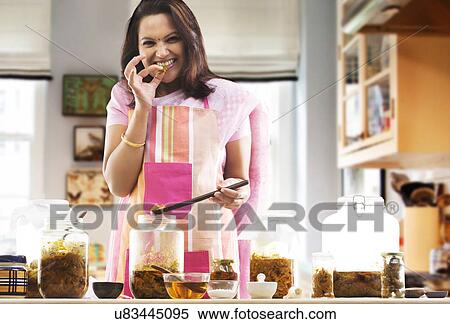 Portrait of a woman eating pickle View Large Photo Image Stock Photography - Portrait of a woman eating pickle . Fotosearch