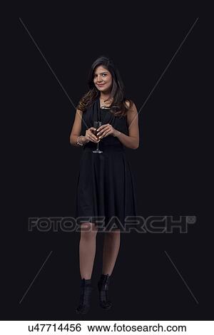 Stock Photograph - Portrait of a woman with a glass of wine. Fotosearch