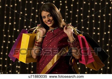 Portrait of a woman with shopping bags View Large Photo Image Stock Photography - Portrait of a woman with shopping bags . Fotosearch