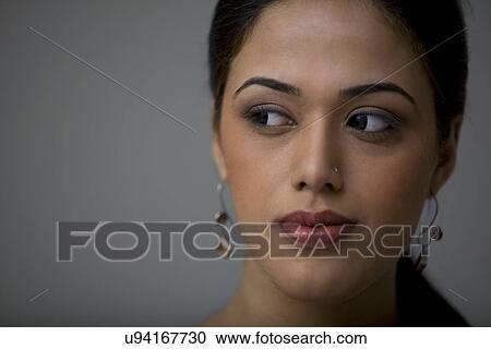 Stock Image - Portrait of a young girl . Fotosearch