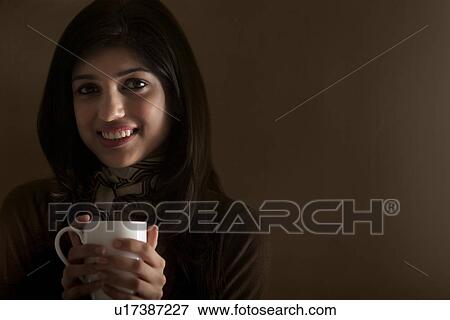 Stock Photo - Portrait of a young girl . Fotosearch
