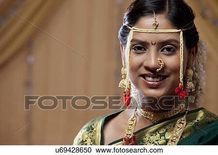 Stock Image - Portrait of beautiful young bride smiling . Fotosearch
