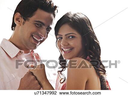 Portrait of couple holding each other View Large Photo Image Stock Image - Portrait of couple holding each other. Fotosearch