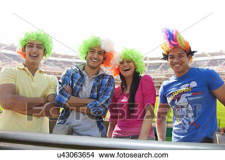 Picture - Portrait of friends with wigs . Fotosearch