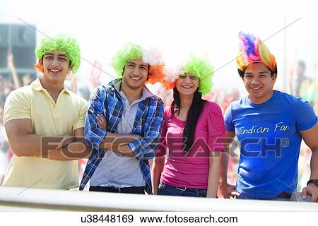Stock Photo - Portrait of friends with wigs . Fotosearch