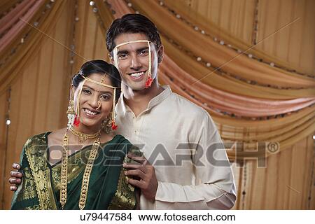 Portrait of happy Maharashtrian couple smiling together on wedding day View Large Photo Image Picture - Portrait of happy Maharashtrian couple smiling together on wedding day . Fotosearch
