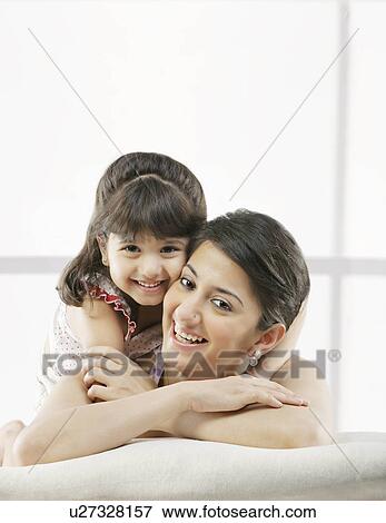 Portrait of mother and daughter View Large Photo Image Stock Photo - Portrait of mother and daughter . Fotosearch
