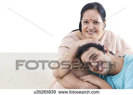 Stock Photo - Portrait of mother and son smiling together . Fotosearch