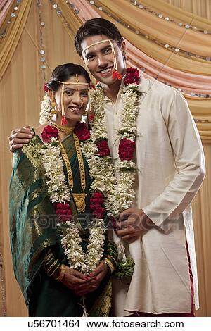 Portrait of newly married couple smiling View Large Photo Image Picture - Portrait of newly married couple smiling . Fotosearch