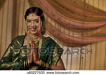 Portrait of pretty young Maharashtrian bride smiling View Large Photo Image Stock Image - Portrait of pretty young Maharashtrian bride smiling . Fotosearch