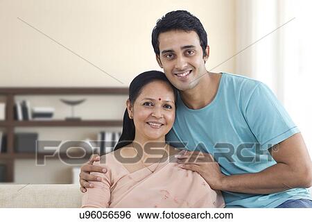 Stock Photograph - Portrait of smiling mother and young son . Fotosearch