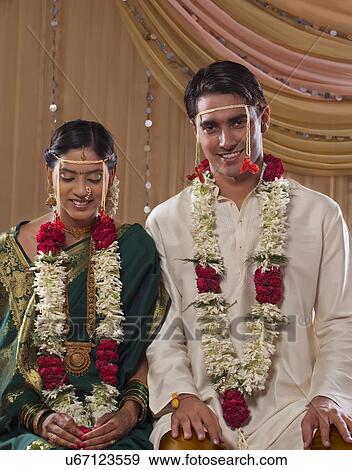 Portrait of smiling newlywed Maharashtrian couple smiling together View Large Photo Image Stock Photo - Portrait of smiling newlywed Maharashtrian couple smiling together . Fotosearch