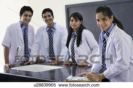 Portrait of students in lab coats View Large Photo Image Stock Photography - Portrait of students in lab coats . Fotosearch